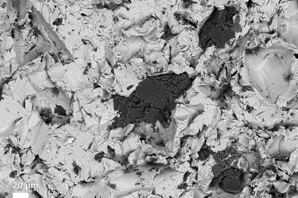 Surface of S355 steel after grit blasting with F80 grit alumina.